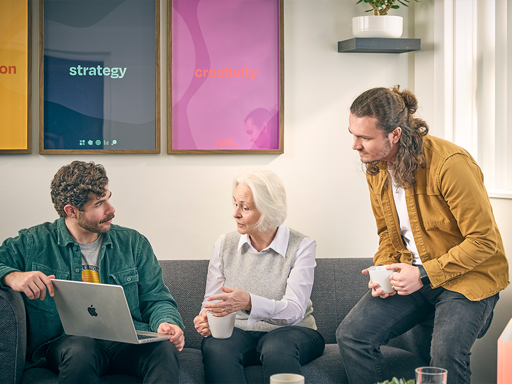 Team discussion at Carousel Marketing